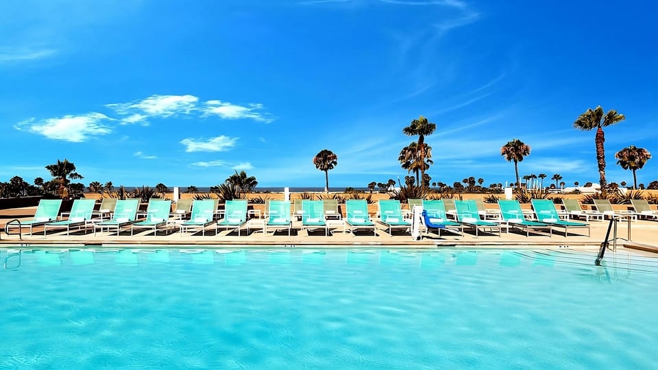 Cool off with a serene swim beneath big blue skies.