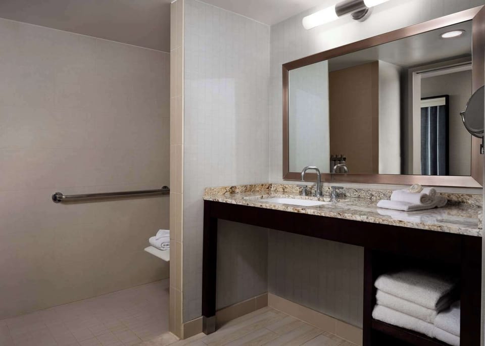 Refresh comfortably with a spacious vanity and fluffy towels.