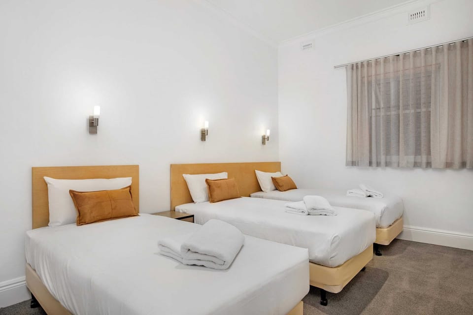 3 large single beds in second bedroom