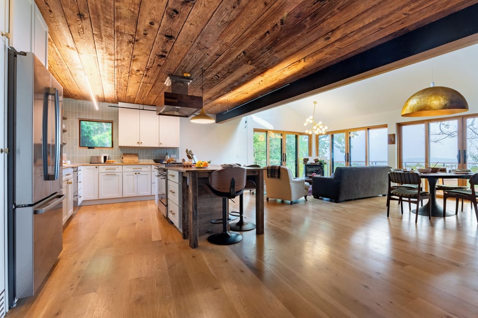 A rustic-modern open-concept kitchen and living area.