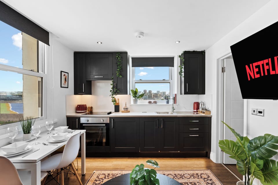 Modern, well-equipped kitchen with stunning city and sea views.