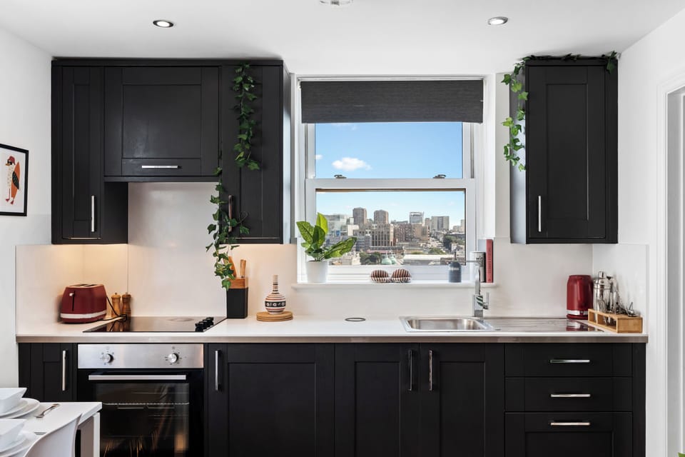 Modern, well-equipped kitchen with stunning city and sea views.