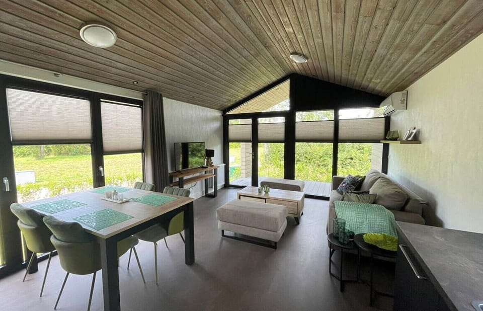 Living room and dining table at Vakantiepark de Zeeuwse Parel - de Parel