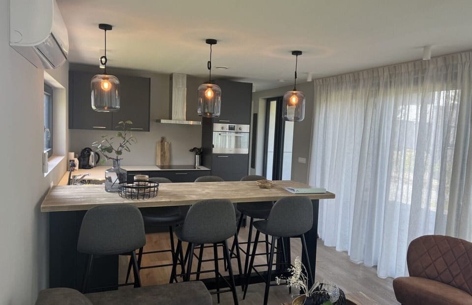 Kitchen and dining table at Holiday Park De Zeeuwse Parel - De Zeebries