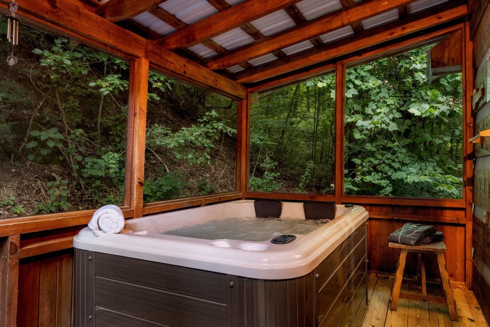 Come relax in our brand new couples hot tub. Located in the screened porch area.