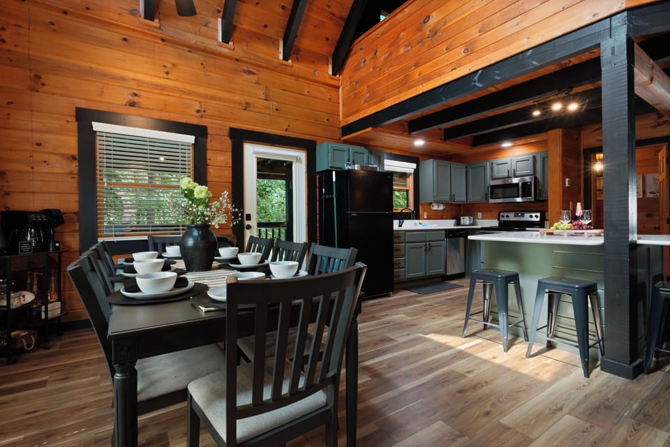 Cozy wood cabin kitchen and dining space with island seating
