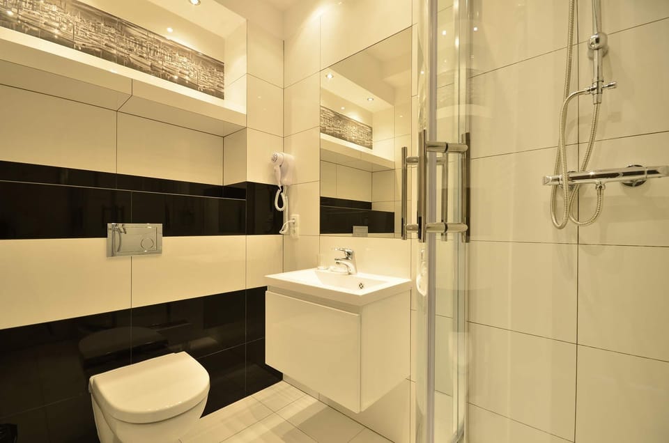 A modern bathroom with shower ensures a comfortable stay.