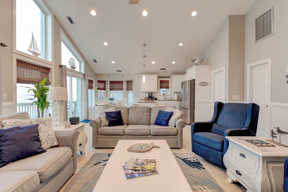 Living room, dining area, kitchen all leading to the oceanfront deck.