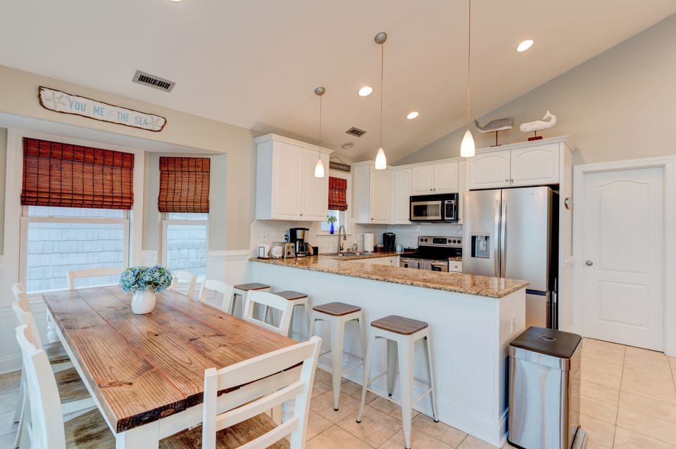 Fully equipped, well-appointed kitchen along with seating for twelve people.
