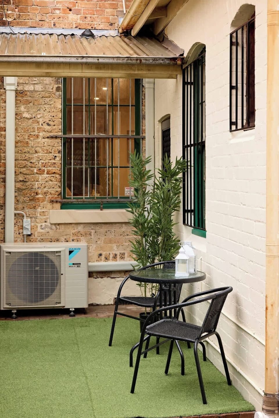 Charming outdoor courtyard with seating for morning coffee or evening drinks. Your own peaceful retreat showcasing authentic Woolloomooloo heritage architecture and character.