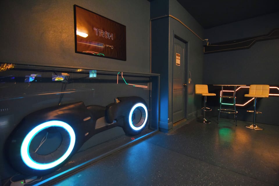 Cool Disney Tron themed games room with pool table, table football, plus arcade