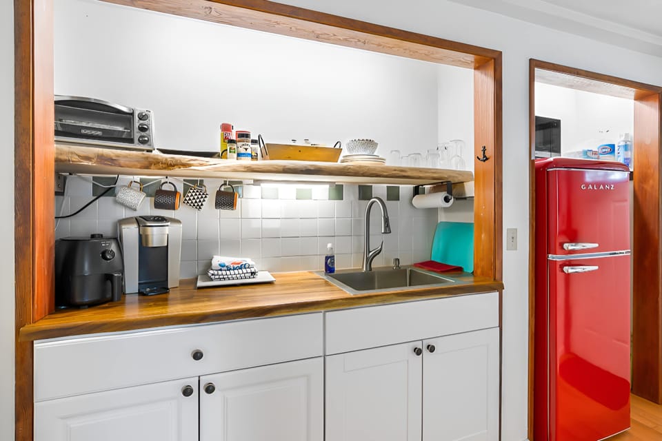 Kitchenette with generous fridge.