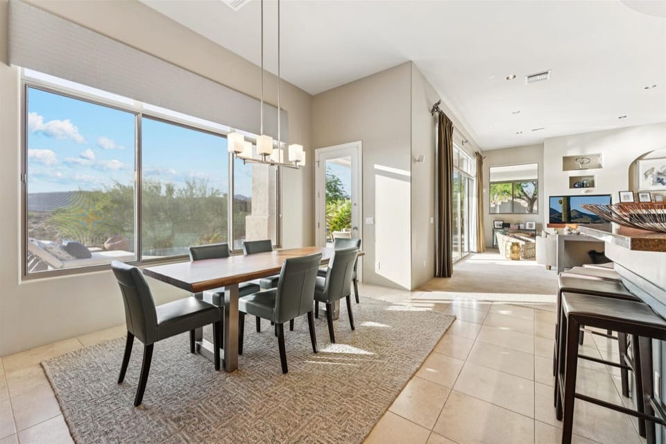 Sunny dining area with a view, ideal for relaxed meals and intimate dinners.