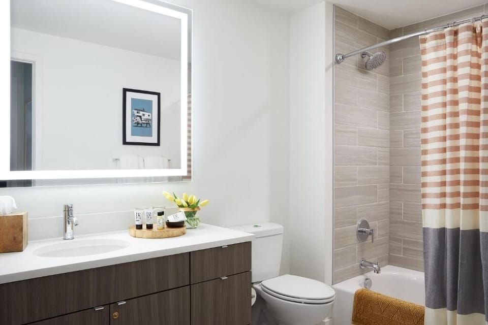 Refresh in a spotless, spa-bright bath with rainfall shower.