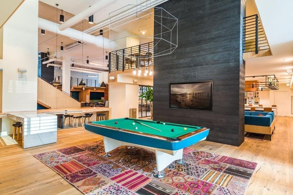 Soak up city energy from this expansive courtyard pool oasis.