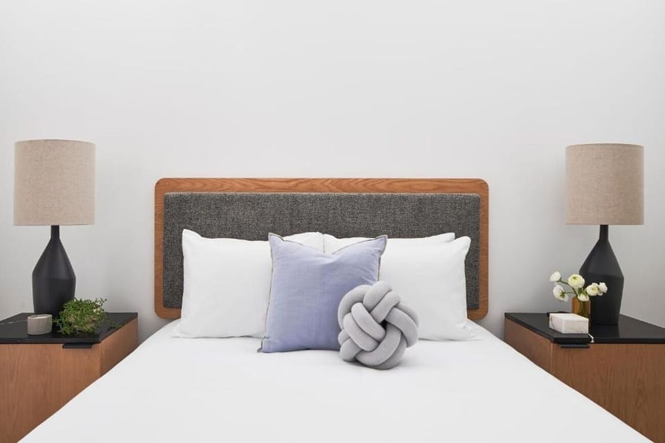 Sink into crisp linens for a calm, restorative sleep.