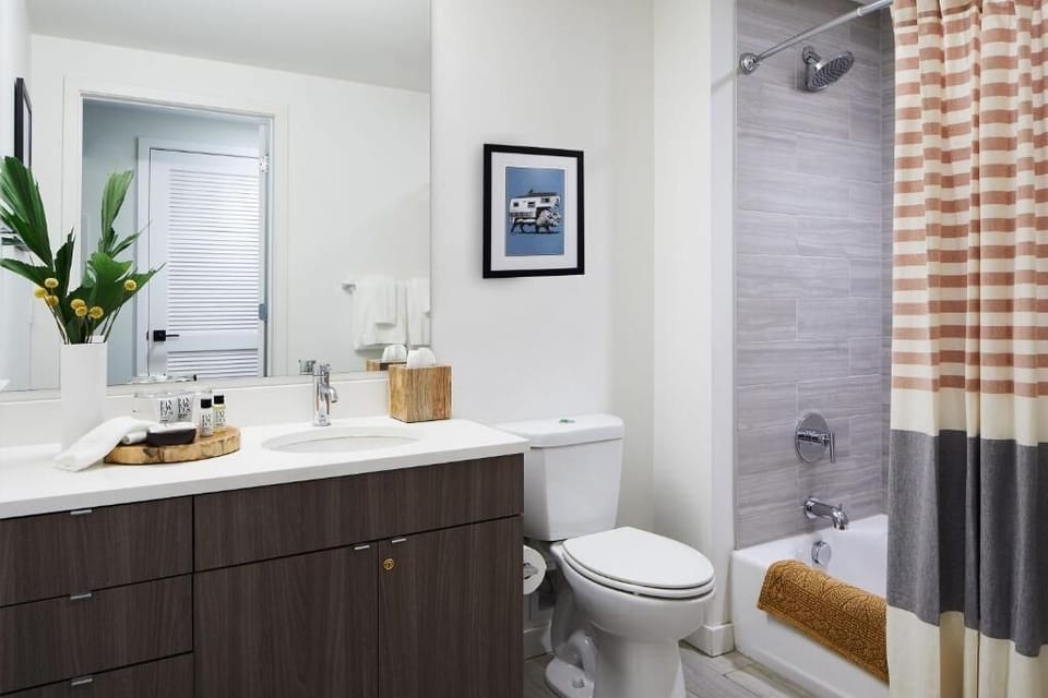 Refresh in a spotless bathroom with plenty of vanity space.