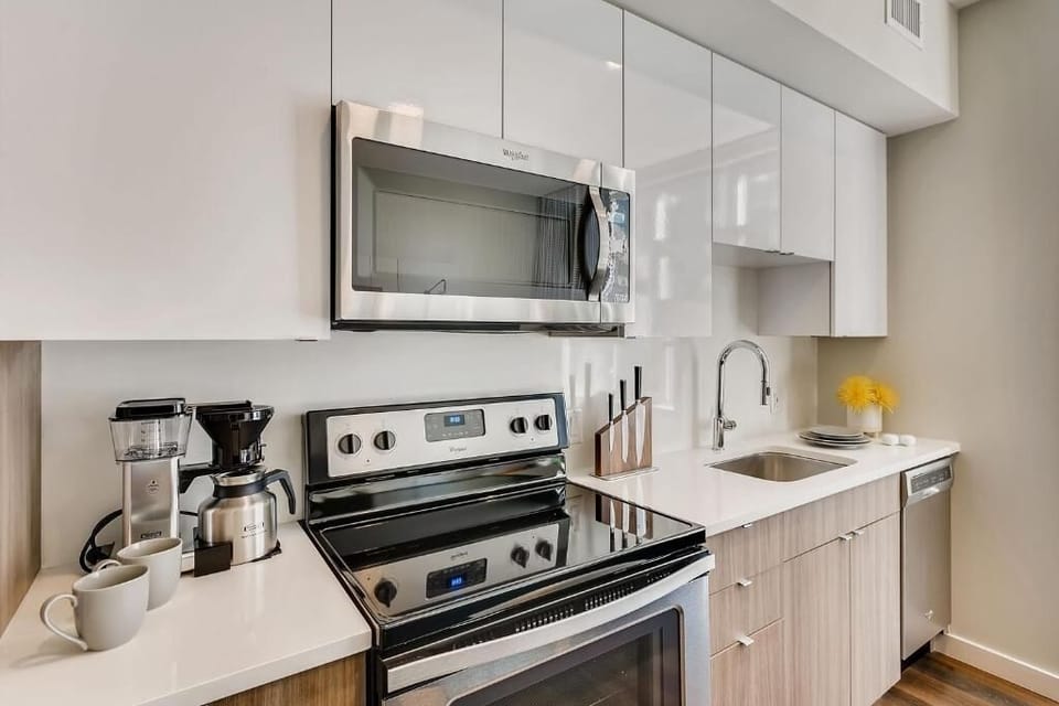 Cook effortlessly in the sleek, full kitchen with modern appliances.