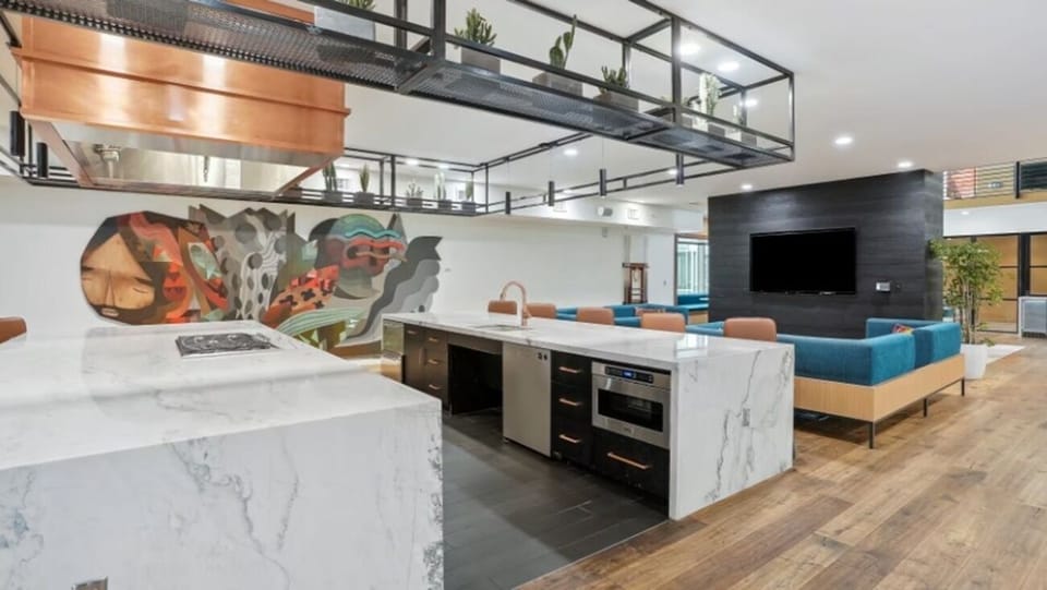 Gather for friendly games under bright, modern loft-style lighting.