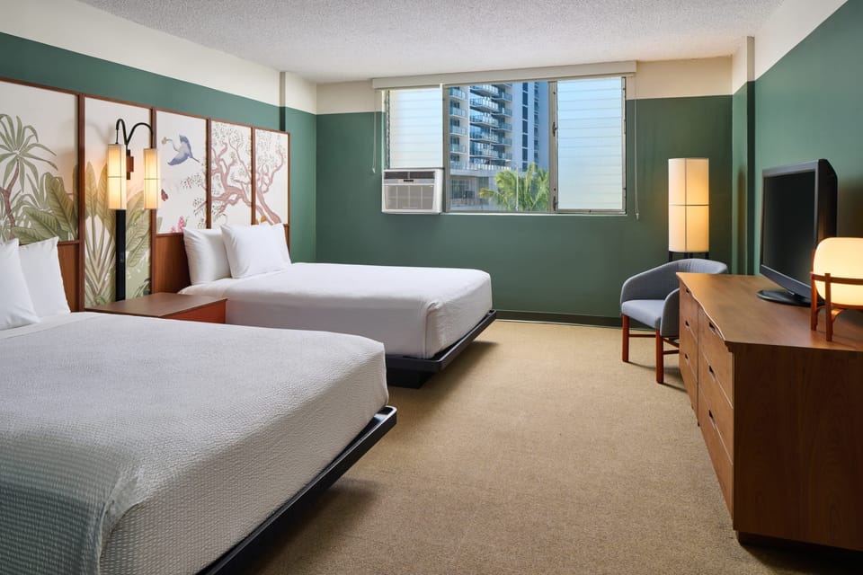 Stretch out comfortably with two beds and warm ambient lighting.