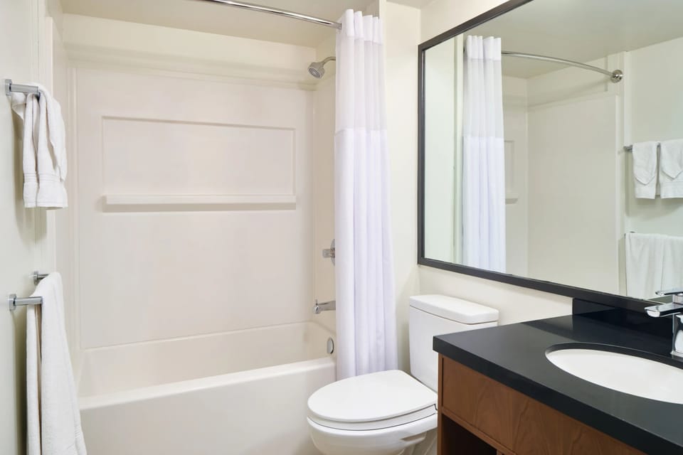 Refresh with a clean, bright bath and fluffy white towels.