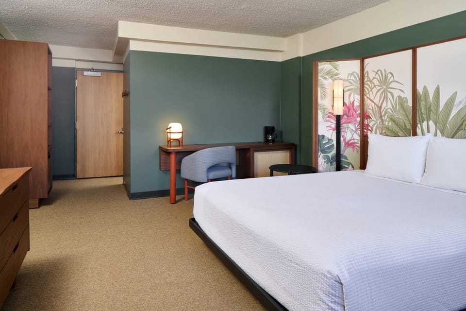 Settle in with a cozy bed and convenient in-room workspace.