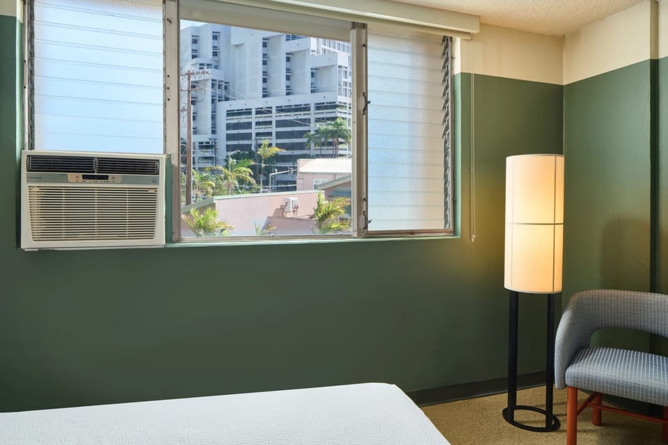 Wake up to bright city views and breezy comfort.