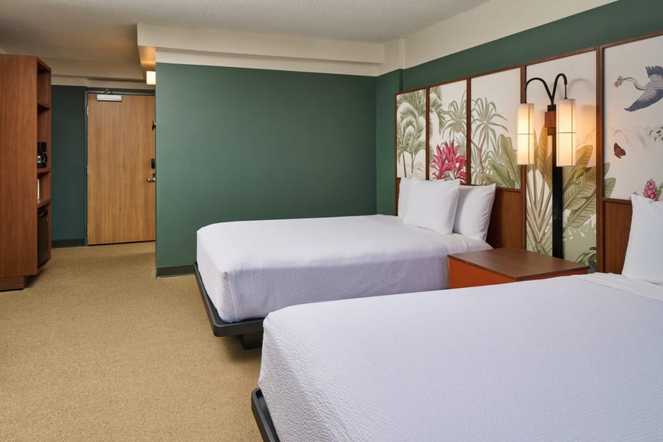 Recharge together in a roomy double-bed setup made for comfort.