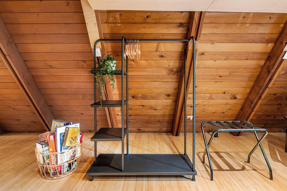 Comfy stay with garment rack, luggage stand, shelves, and games.