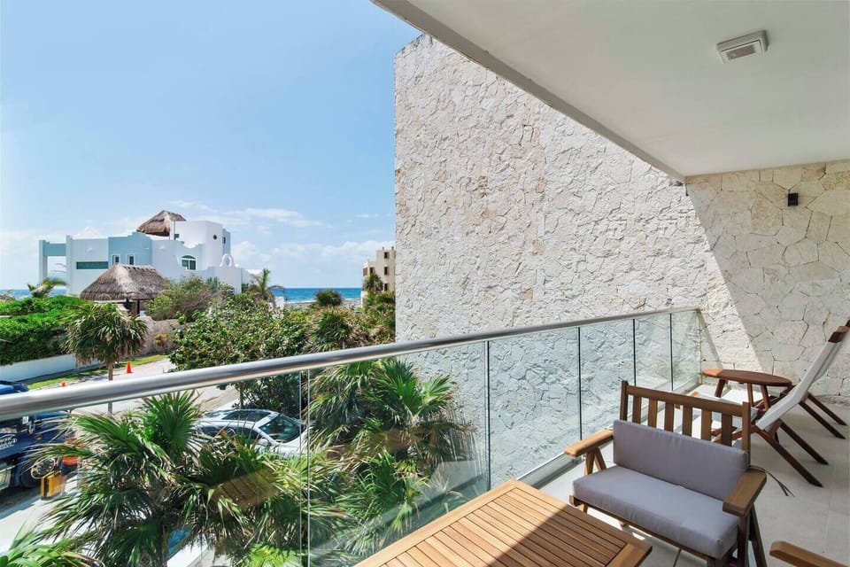Private balcony off living room with sea breeze and stunning Caribbean views.