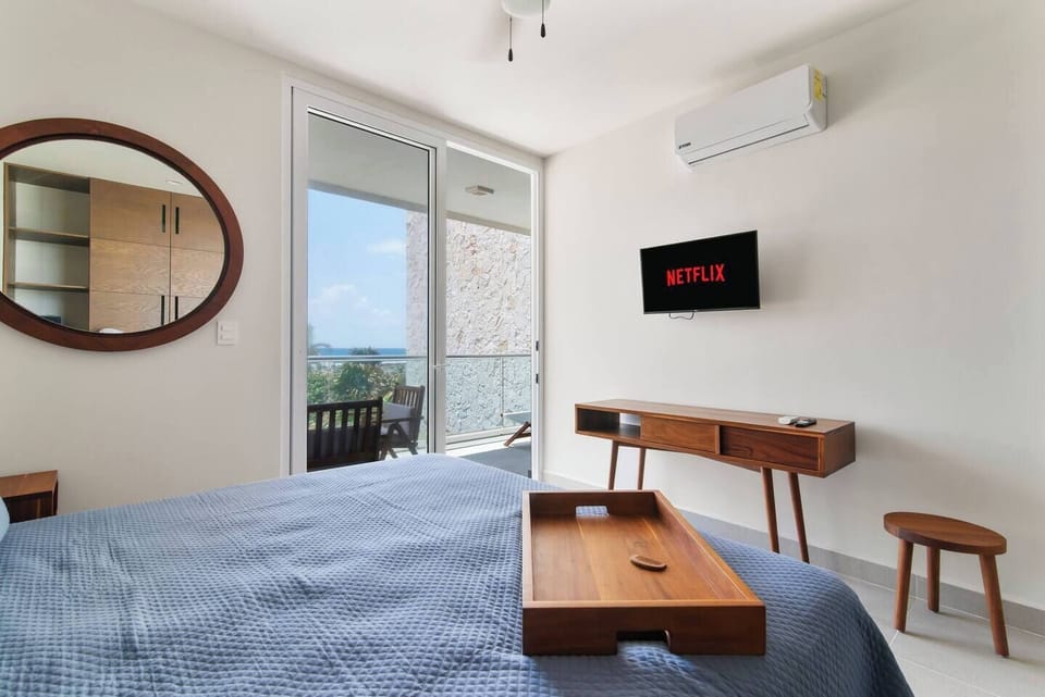 Wake up on this king-size bed, step out onto your private balcony.