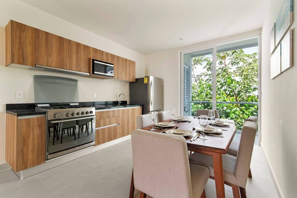 Fully equipped kitchen with stove, microwave, fridge, and all cookware included.