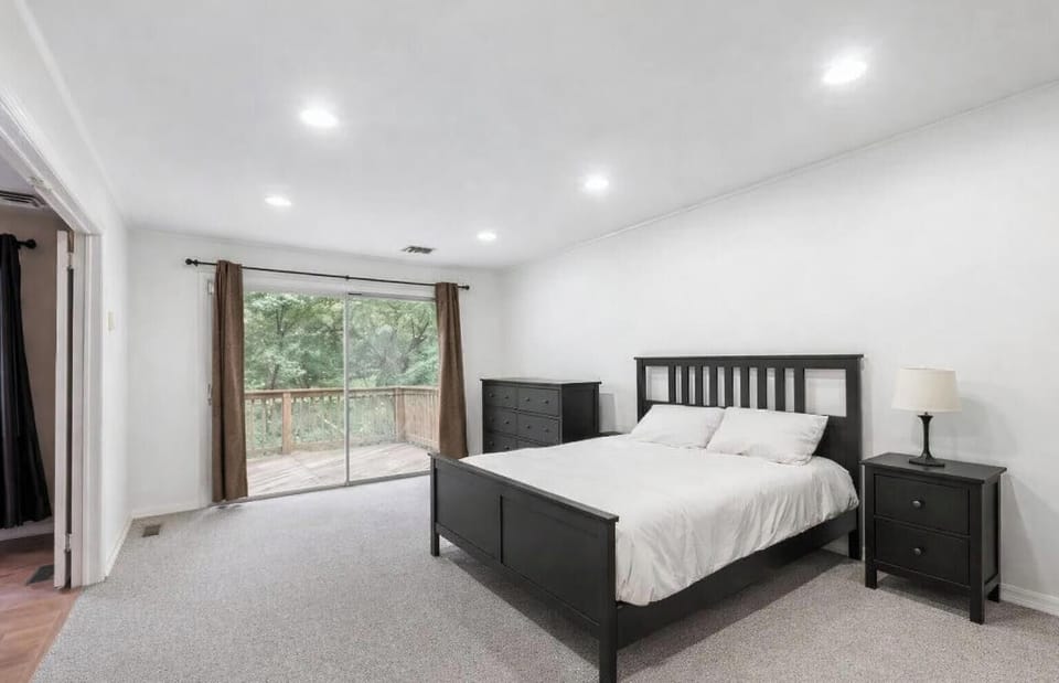 1st floor bedroom leading out to backyard deck - queen bed