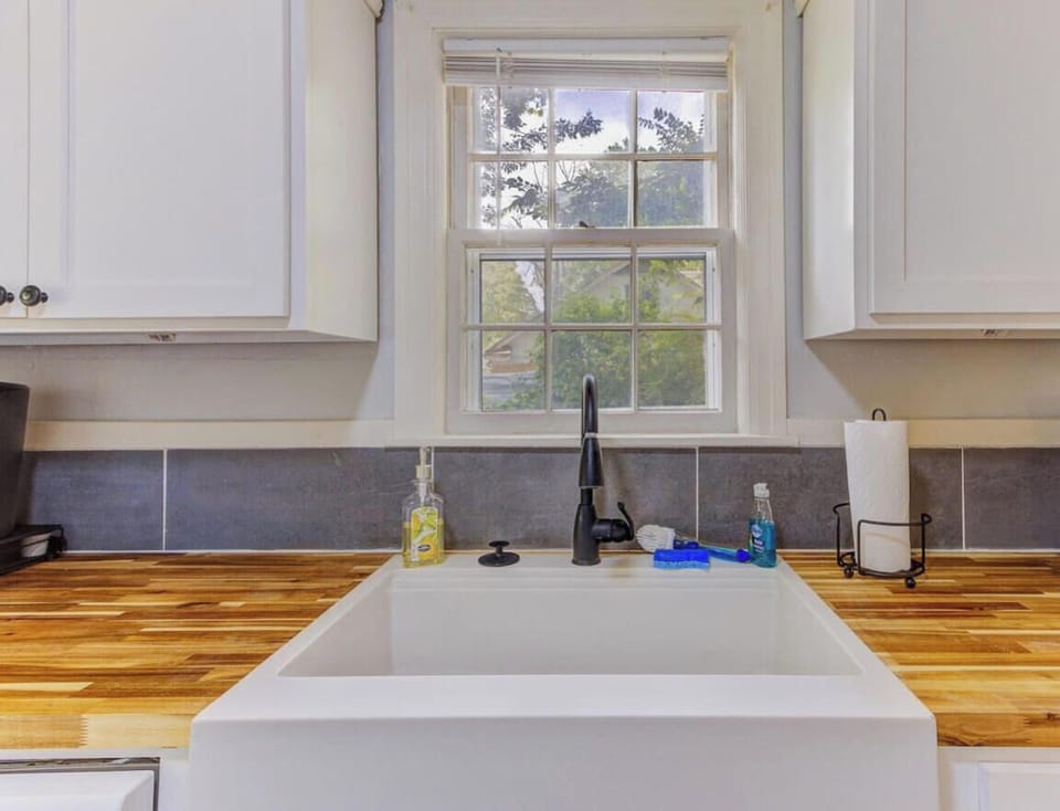 Wash up with a peaceful view of the greenery right from the farmhouse sink.