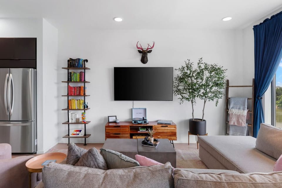 Spacious living room with queen pull-out couch, stunning riverfront views, and a Smart TV for your entertainment. Enjoy your morning coffee on our private patio that overlooks Cumberland river.