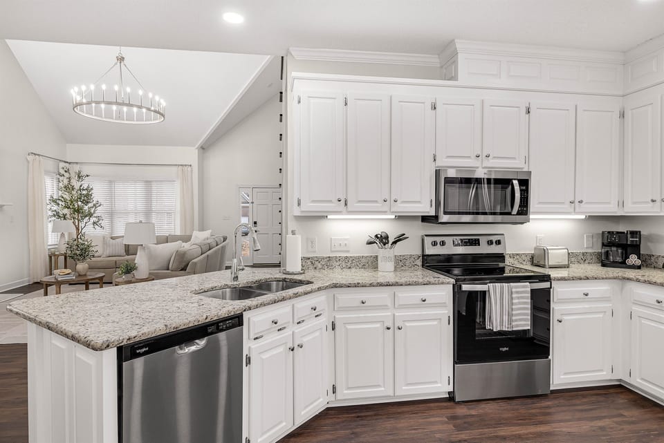 Kitchen is fully stocked with coffee pot, toaster, blender, mixer and ice maker in the refrigerator 