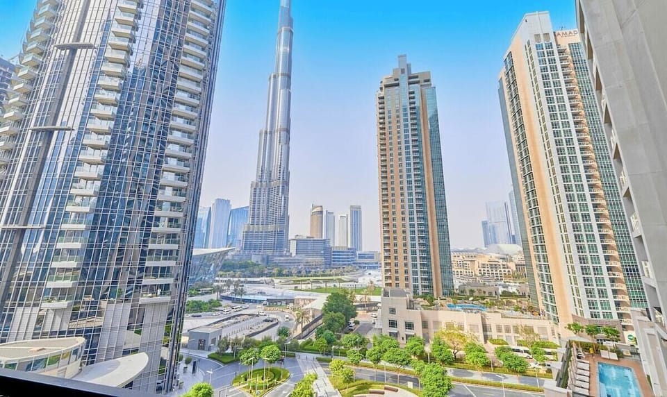 Step out onto a private balcony with unbeatable Burj Khalifa views, stylish wooden seating, and the perfect setting for a morning coffee or romantic evening.