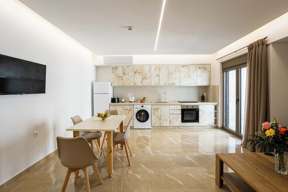 Bright Kitchen with Washing Machine – Includes fridge, oven, and storage.