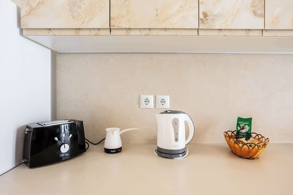 Coffee Station with Kettle and Essentials – Convenient setup for preparing your morning coffee or tea.