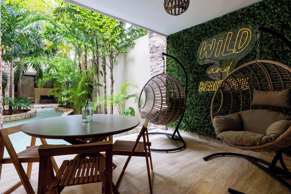 Dine al fresco in your charming outdoor space, surrounded by lush greenery.