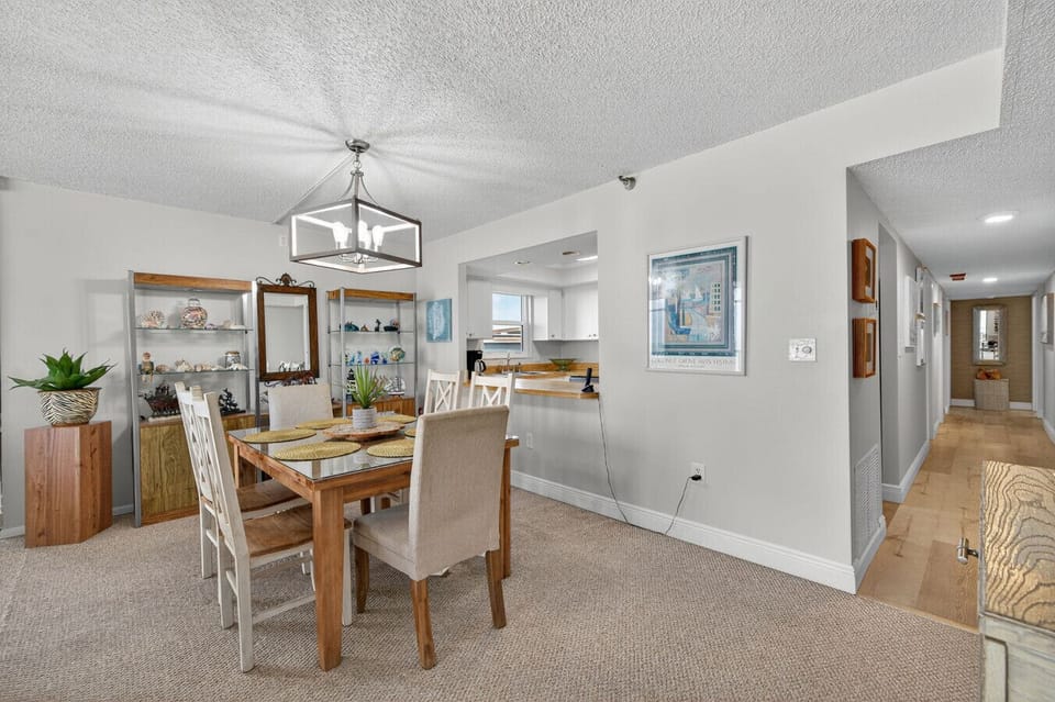 Welcoming dining area w/ warm wood floors & a clean, open layout.