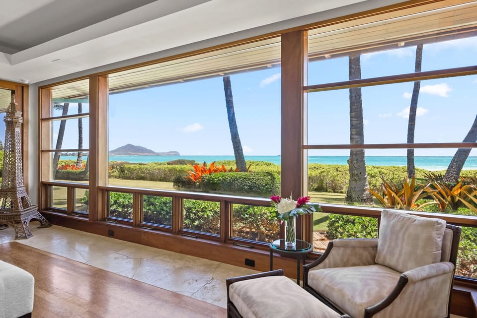 Primary suite with panoramic ocean view windows.
