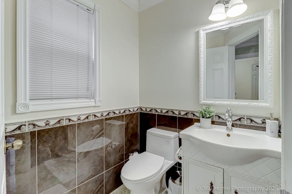 A sleek and modern half bath, perfect for quick refreshes.