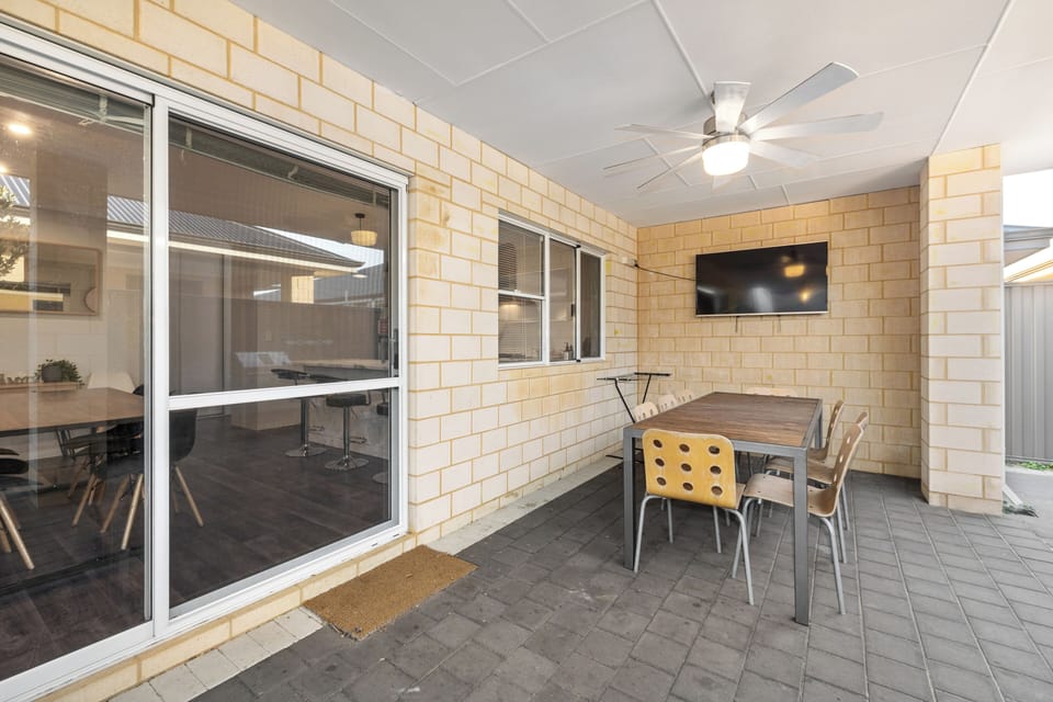 Take your relaxation outdoors on the covered patio! With a mounted TV, a ceiling fan, and plenty of seating, this is the ideal spot to unwind with a drink or enjoy a meal in the open air.