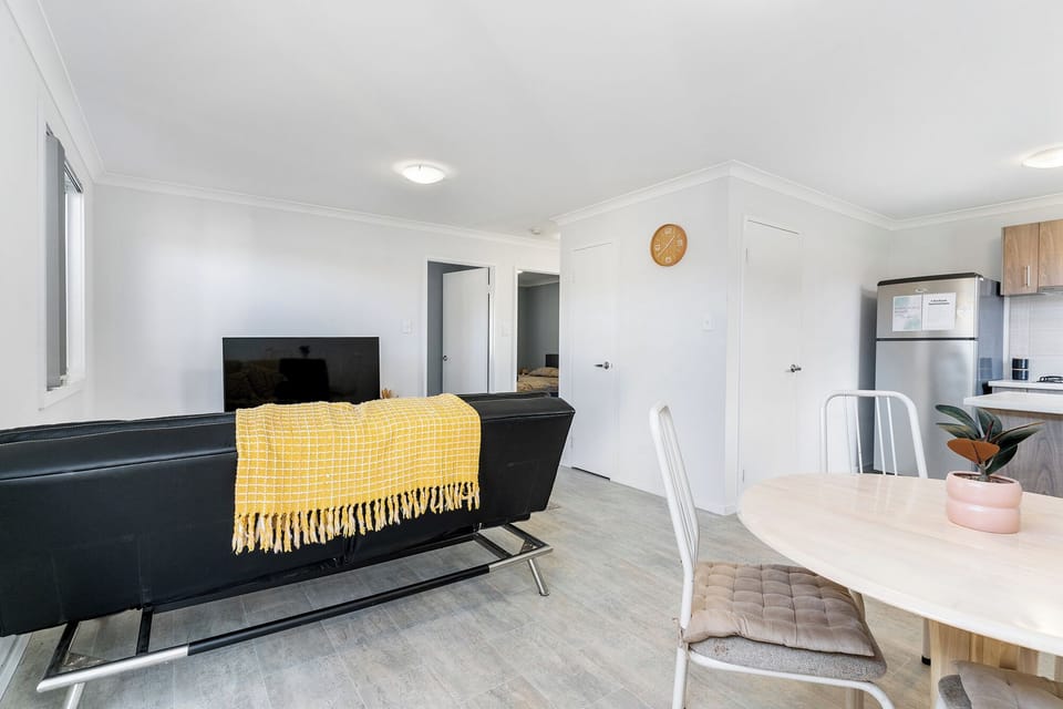 Welcome to the heart of our home! Our open-concept living and dining area is the perfect central space to gather, share a meal, and unwind together after a day of exploring.