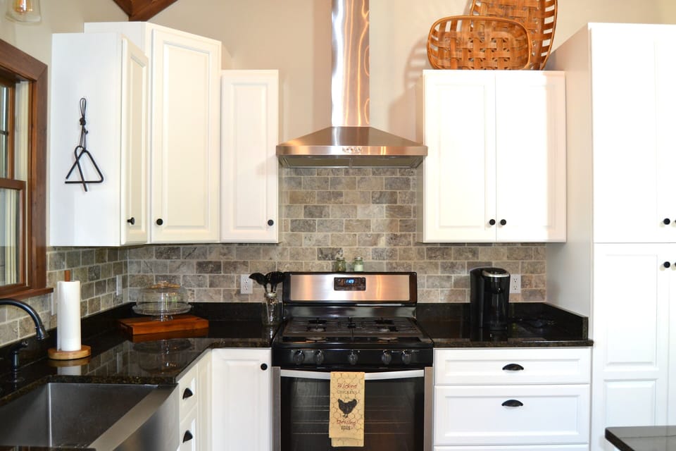Kitchen with tile and granite features.