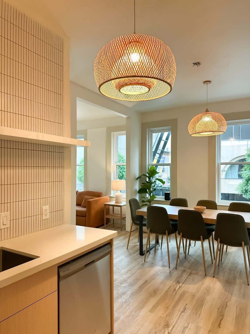 Bright open-concept kitchen and dining area with warm pendant lighting—perfect for cooking, gathering, and making memories