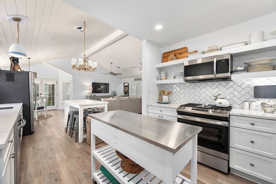 an extra island for kitchen prep and the cooking area, plenty of dishes