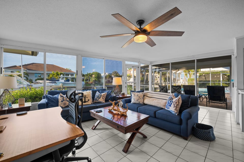 3-Season Room. 2 Sofas. Flat TV. Sit/Stand Desk. Pool and water views.