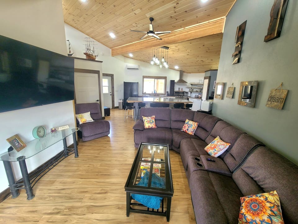 Comfortable living room with smart TV for Netflicks, Prime, and rock channels.